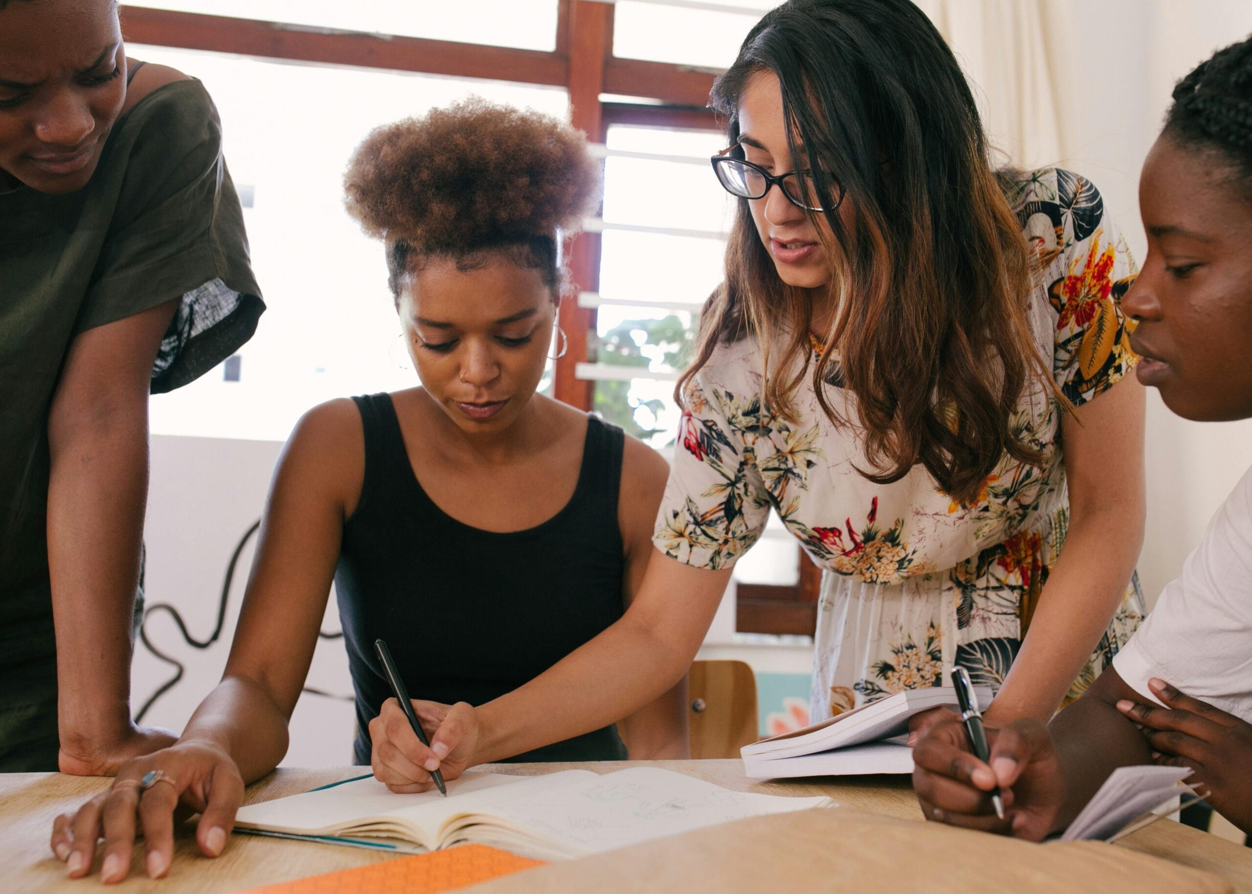 A group of diverse professionals collaborates on a project, fostering teamwork and creativity.